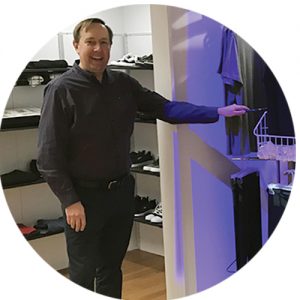 Jeffrey Kerr showing his organized closet system.